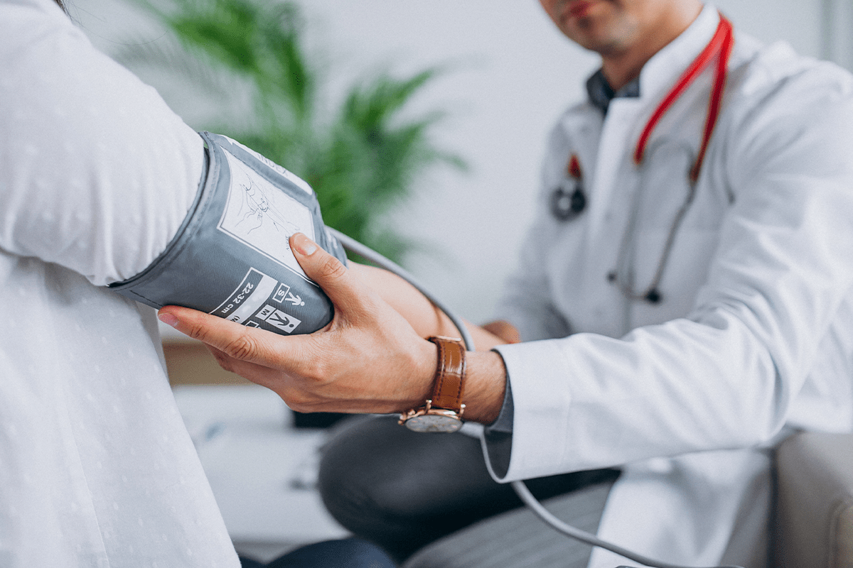 Doctor examines patient for signs of stroke