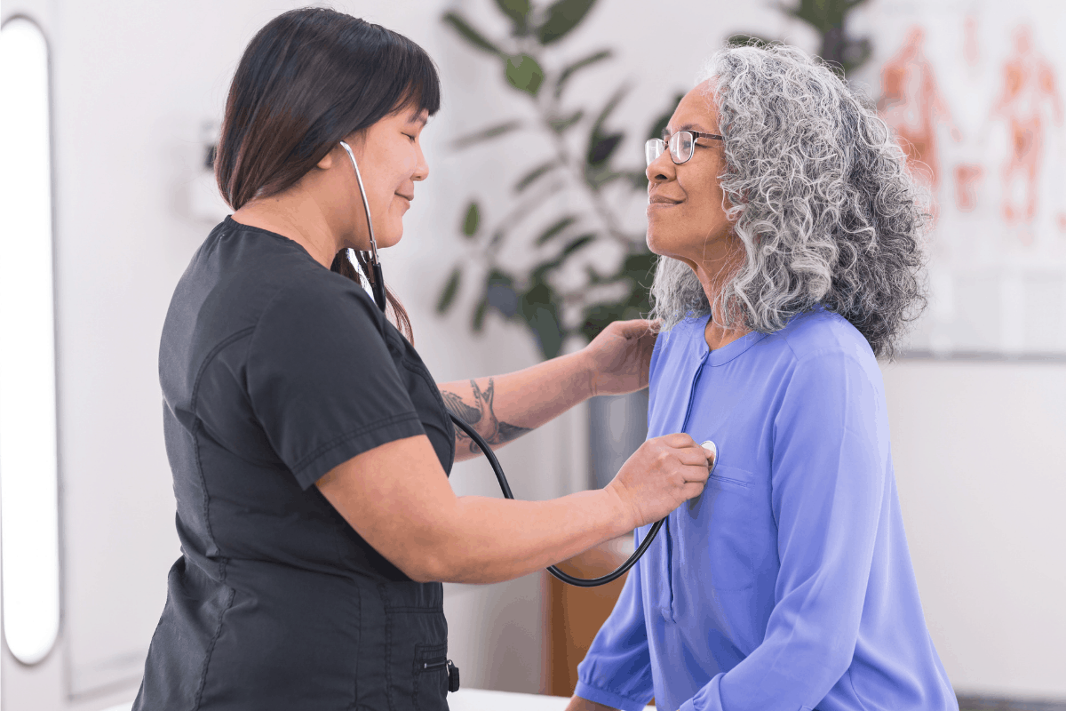 Physician checks patient during a preventative care visit