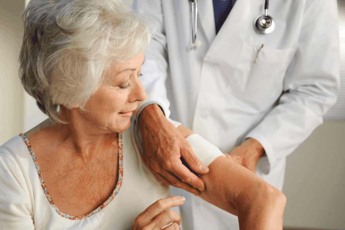 Specialist fills out forms during preventative care visit