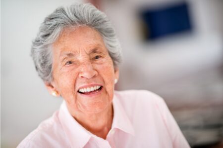 Happy senior woman who may struggle with alzheimers or dementia